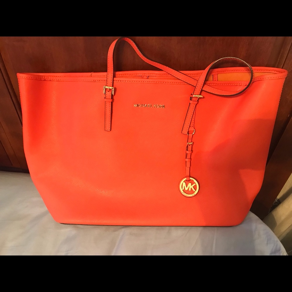 Michael Kors orange leather tote bag